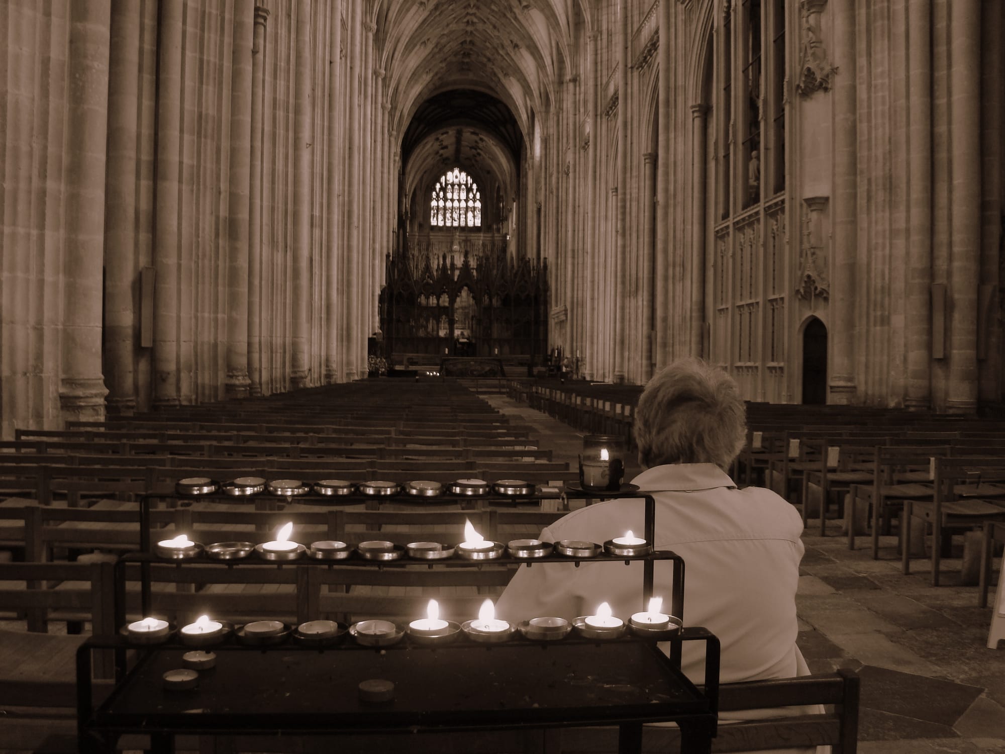 An image of a woman sat in Winchester Cathedral