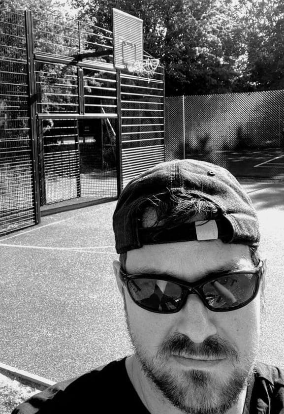 A selfie of Rob Lambert playing basketball