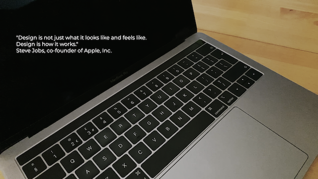 A Macbook with the words Design is how it works by Steve Jobs