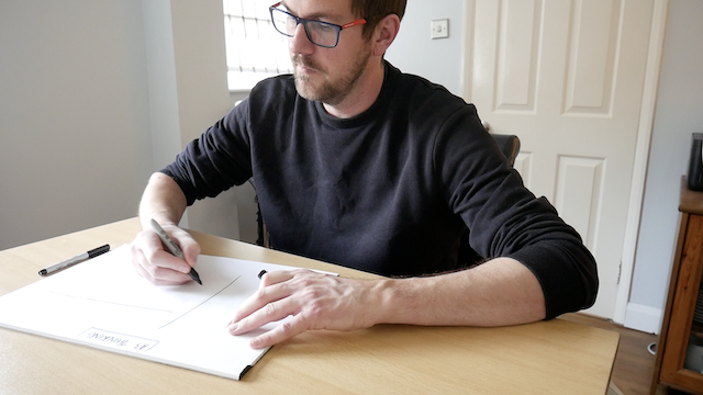 An image of Rob Lambert filling in details on the A3 thinking page